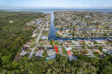 This is the one you've been waiting for -- 66 feet of waterfront on Gulf Harbors Golf Course in Florida - for sale on GolfHomes.com, golf home, golf lot