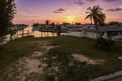 This is the one you've been waiting for -- 66 feet of waterfront on Gulf Harbors Golf Course in Florida - for sale on GolfHomes.com, golf home, golf lot