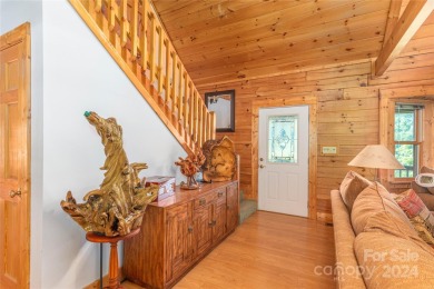 NO DAMAGE FROM HELENE-HIGH  DRY. This warm and inviting log home on Waynesville Country Club Inn in North Carolina - for sale on GolfHomes.com, golf home, golf lot