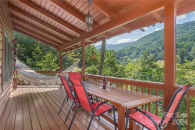 NO DAMAGE FROM HELENE-HIGH  DRY. This warm and inviting log home on Waynesville Country Club Inn in North Carolina - for sale on GolfHomes.com, golf home, golf lot