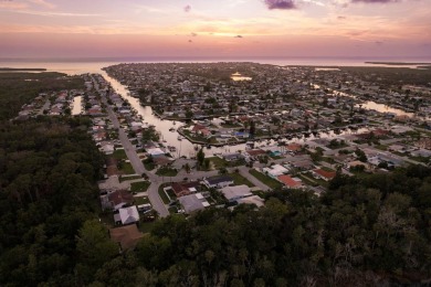 This is the one you've been waiting for -- 66 feet of waterfront on Gulf Harbors Golf Course in Florida - for sale on GolfHomes.com, golf home, golf lot