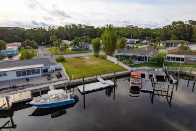 This is the one you've been waiting for -- 66 feet of waterfront on Gulf Harbors Golf Course in Florida - for sale on GolfHomes.com, golf home, golf lot