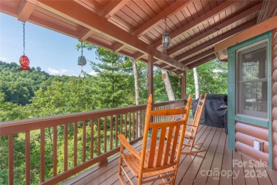 NO DAMAGE FROM HELENE-HIGH  DRY. This warm and inviting log home on Waynesville Country Club Inn in North Carolina - for sale on GolfHomes.com, golf home, golf lot