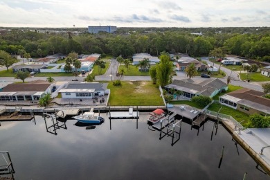 This is the one you've been waiting for -- 66 feet of waterfront on Gulf Harbors Golf Course in Florida - for sale on GolfHomes.com, golf home, golf lot