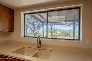 This charming home in Rio Rico, Arizona offers breathtaking on Rio Rico Resort and Country Club in Arizona - for sale on GolfHomes.com, golf home, golf lot