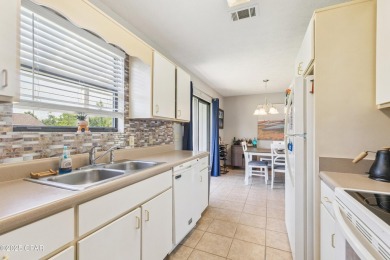 Well-maintained 3-bedroom, 2-bath home located in central Lynn on Panama Country Club in Florida - for sale on GolfHomes.com, golf home, golf lot