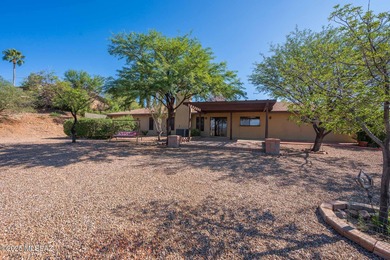 This charming home in Rio Rico, Arizona offers breathtaking on Rio Rico Resort and Country Club in Arizona - for sale on GolfHomes.com, golf home, golf lot