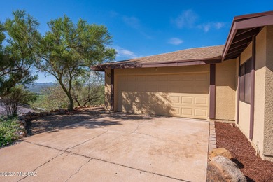 Perched on a hilltop in desirable Rio Rico, this spacious 2,603 on Rio Rico Resort and Country Club in Arizona - for sale on GolfHomes.com, golf home, golf lot