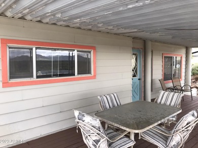 Enjoy stunning views from this beautifully maintained home on Queen Valley Golf Course in Arizona - for sale on GolfHomes.com, golf home, golf lot