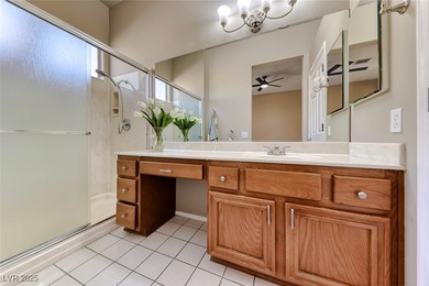 Charming single story home in the vibrant Sun City Summerlin 55+ on Eagle Crest Golf Club in Nevada - for sale on GolfHomes.com, golf home, golf lot