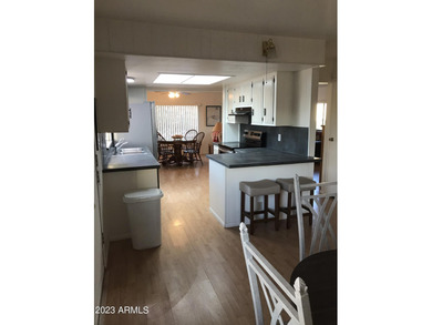 Enjoy stunning views from this beautifully maintained home on Queen Valley Golf Course in Arizona - for sale on GolfHomes.com, golf home, golf lot