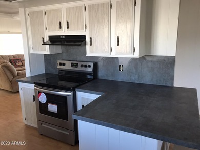 Enjoy stunning views from this beautifully maintained home on Queen Valley Golf Course in Arizona - for sale on GolfHomes.com, golf home, golf lot