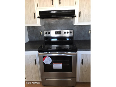 Enjoy stunning views from this beautifully maintained home on Queen Valley Golf Course in Arizona - for sale on GolfHomes.com, golf home, golf lot