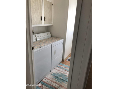 Enjoy stunning views from this beautifully maintained home on Queen Valley Golf Course in Arizona - for sale on GolfHomes.com, golf home, golf lot