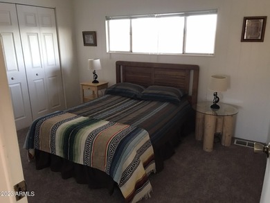 Enjoy stunning views from this beautifully maintained home on Queen Valley Golf Course in Arizona - for sale on GolfHomes.com, golf home, golf lot