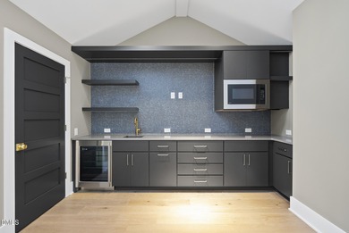 Stunning luxury home and pool house on NRCC 9th Fairway of the on North Ridge Country Club in North Carolina - for sale on GolfHomes.com, golf home, golf lot