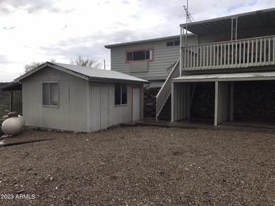 Enjoy stunning views from this beautifully maintained home on Queen Valley Golf Course in Arizona - for sale on GolfHomes.com, golf home, golf lot