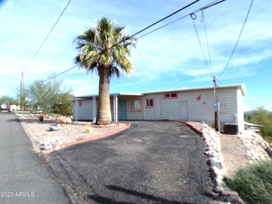 Enjoy stunning views from this beautifully maintained home on Queen Valley Golf Course in Arizona - for sale on GolfHomes.com, golf home, golf lot