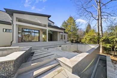 Stunning luxury home and pool house on NRCC 9th Fairway of the on North Ridge Country Club in North Carolina - for sale on GolfHomes.com, golf home, golf lot