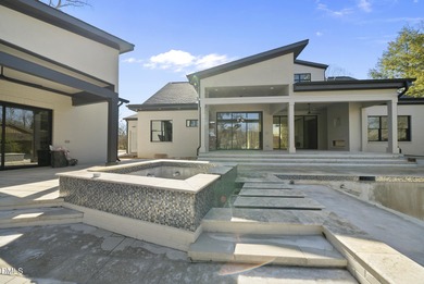 Stunning luxury home and pool house on NRCC 9th Fairway of the on North Ridge Country Club in North Carolina - for sale on GolfHomes.com, golf home, golf lot