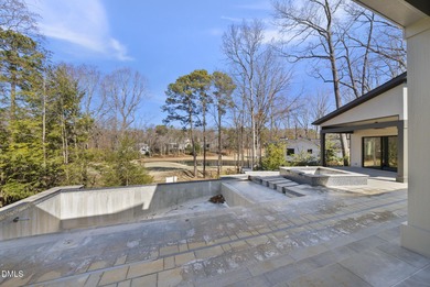 Stunning luxury home and pool house on NRCC 9th Fairway of the on North Ridge Country Club in North Carolina - for sale on GolfHomes.com, golf home, golf lot