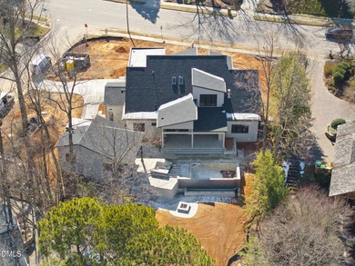 Stunning luxury home and pool house on NRCC 9th Fairway of the on North Ridge Country Club in North Carolina - for sale on GolfHomes.com, golf home, golf lot