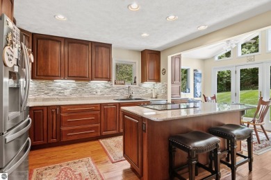 Beautiful view of Crystal Lake from this updated 4 BR home on Crystal Lake Golf Club in Michigan - for sale on GolfHomes.com, golf home, golf lot