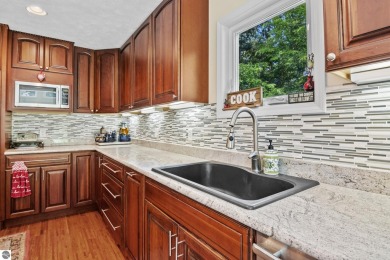 Beautiful view of Crystal Lake from this updated 4 BR home on Crystal Lake Golf Club in Michigan - for sale on GolfHomes.com, golf home, golf lot