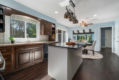 Welcome to this exceptional 5-bedroom, 4.1-bathroom residence on Hillcrest Country Club in Illinois - for sale on GolfHomes.com, golf home, golf lot