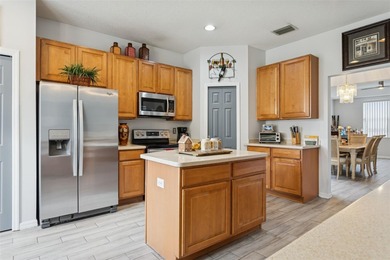 Beautiful well-maintained home on a gorgeous golf course lot in on Heritage Isles Golf and Country Club in Florida - for sale on GolfHomes.com, golf home, golf lot