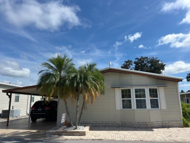 IMMACULATE, PARTIALLY FURNISHED HOME WITH GOLF CART ON THE WATER on Silver Dollar Golf and Trap Club in Florida - for sale on GolfHomes.com, golf home, golf lot