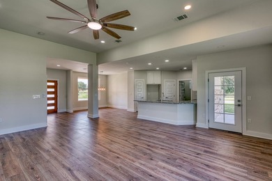 Impressive new construction in the sought-after Lighthouse on Packsaddle Country Club in Texas - for sale on GolfHomes.com, golf home, golf lot