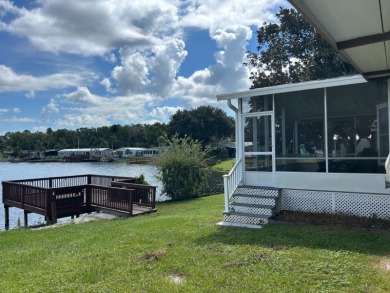 IMMACULATE, PARTIALLY FURNISHED HOME WITH GOLF CART ON THE WATER on Silver Dollar Golf and Trap Club in Florida - for sale on GolfHomes.com, golf home, golf lot