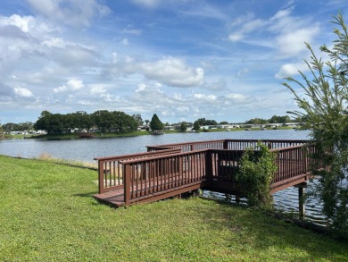 IMMACULATE, PARTIALLY FURNISHED HOME WITH GOLF CART ON THE WATER on Silver Dollar Golf and Trap Club in Florida - for sale on GolfHomes.com, golf home, golf lot