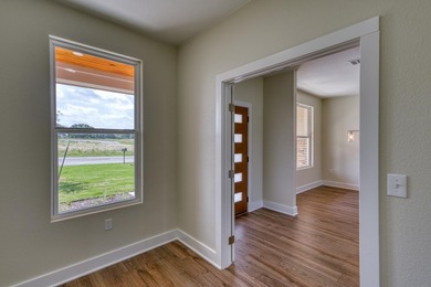 Impressive new construction in the sought-after Lighthouse on Packsaddle Country Club in Texas - for sale on GolfHomes.com, golf home, golf lot