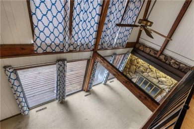 Discover this one-of-a-kind, three-level home nestled on two on Holiday Island Golf Course in Arkansas - for sale on GolfHomes.com, golf home, golf lot