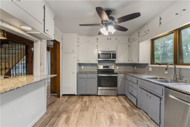 Discover this one-of-a-kind, three-level home nestled on two on Holiday Island Golf Course in Arkansas - for sale on GolfHomes.com, golf home, golf lot