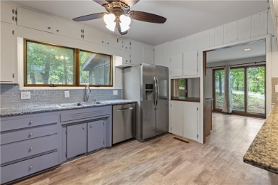 Discover this one-of-a-kind, three-level home nestled on two on Holiday Island Golf Course in Arkansas - for sale on GolfHomes.com, golf home, golf lot