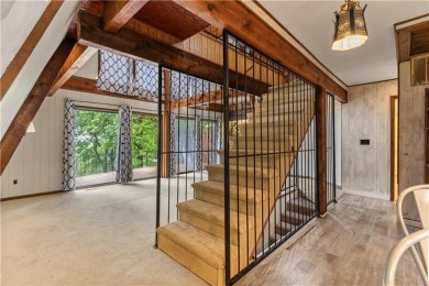 Discover this one-of-a-kind, three-level home nestled on two on Holiday Island Golf Course in Arkansas - for sale on GolfHomes.com, golf home, golf lot