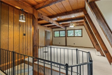 Discover this one-of-a-kind, three-level home nestled on two on Holiday Island Golf Course in Arkansas - for sale on GolfHomes.com, golf home, golf lot