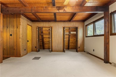 Discover this one-of-a-kind, three-level home nestled on two on Holiday Island Golf Course in Arkansas - for sale on GolfHomes.com, golf home, golf lot