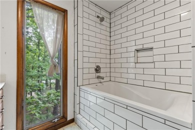 Discover this one-of-a-kind, three-level home nestled on two on Holiday Island Golf Course in Arkansas - for sale on GolfHomes.com, golf home, golf lot