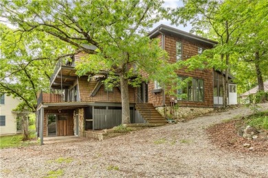 Discover this one-of-a-kind, three-level home nestled on two on Holiday Island Golf Course in Arkansas - for sale on GolfHomes.com, golf home, golf lot