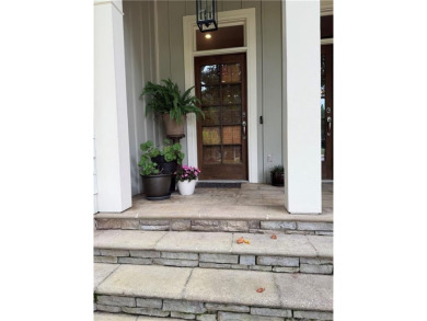 Nestled on a serene, wooded lot with immaculate landscaping and on Moores Mill Golf Club in Alabama - for sale on GolfHomes.com, golf home, golf lot