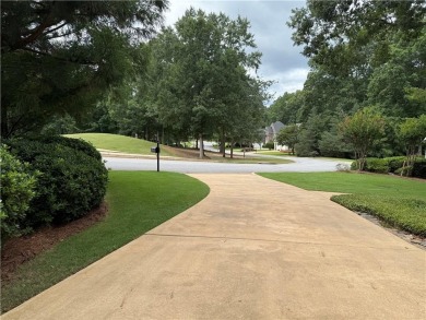 Nestled on a serene, wooded lot with immaculate landscaping and on Moores Mill Golf Club in Alabama - for sale on GolfHomes.com, golf home, golf lot