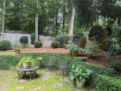 Nestled on a serene, wooded lot with immaculate landscaping and on Moores Mill Golf Club in Alabama - for sale on GolfHomes.com, golf home, golf lot