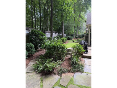 Nestled on a serene, wooded lot with immaculate landscaping and on Moores Mill Golf Club in Alabama - for sale on GolfHomes.com, golf home, golf lot