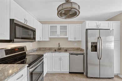 Step into this beautifully updated 2-bedroom, 2-bath first-floor on Palm Aire Country Club of Sarasota in Florida - for sale on GolfHomes.com, golf home, golf lot