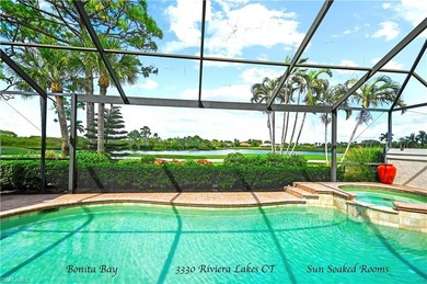 THE ONE YOU HAVE BEEN WAITING FOR! STUNNING POOL HOME WITH WATER on Bonita Bay West in Florida - for sale on GolfHomes.com, golf home, golf lot