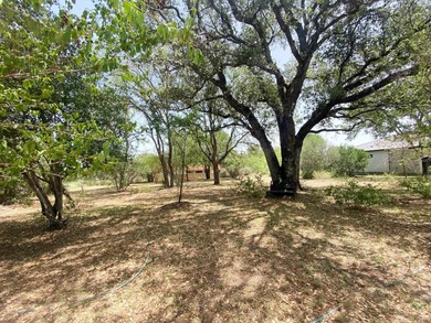 Tucked away on a quiet cul-de-sac in the heart of Horseshoe Bay on Slick Rock Golf Course - Horseshoe Bay in Texas - for sale on GolfHomes.com, golf home, golf lot